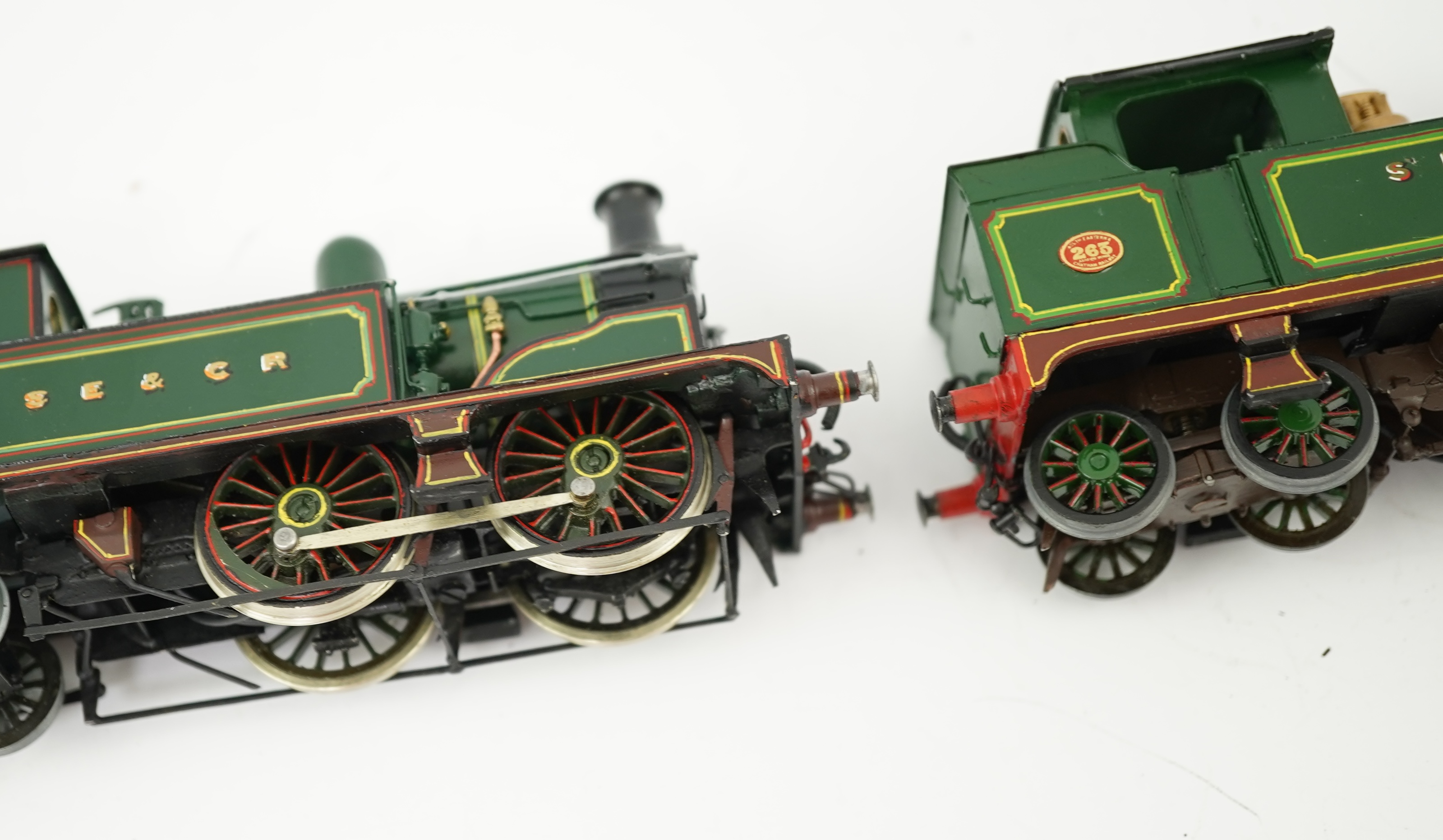 Three 00 gauge brass and white metal kit built Wainwright designed SE&CR tank locomotives (possibly by Wills Finecast); a class R1 0-4-4T, 696, a class H 0-4-4T, 263, and a class P 0-6-0T, 325, constructed, all painted a